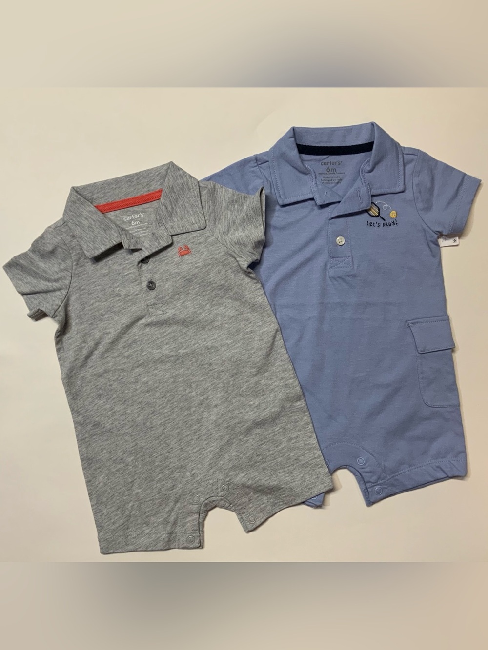 Set of 2 Carter's Polo Rompers 1- Grey, 1- Blue with embroidered details.